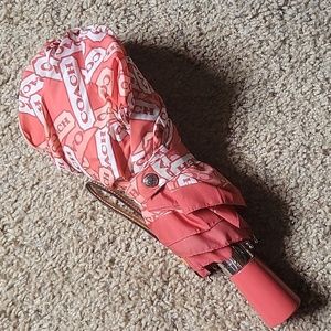 Coach tag plate peach coral umbrella